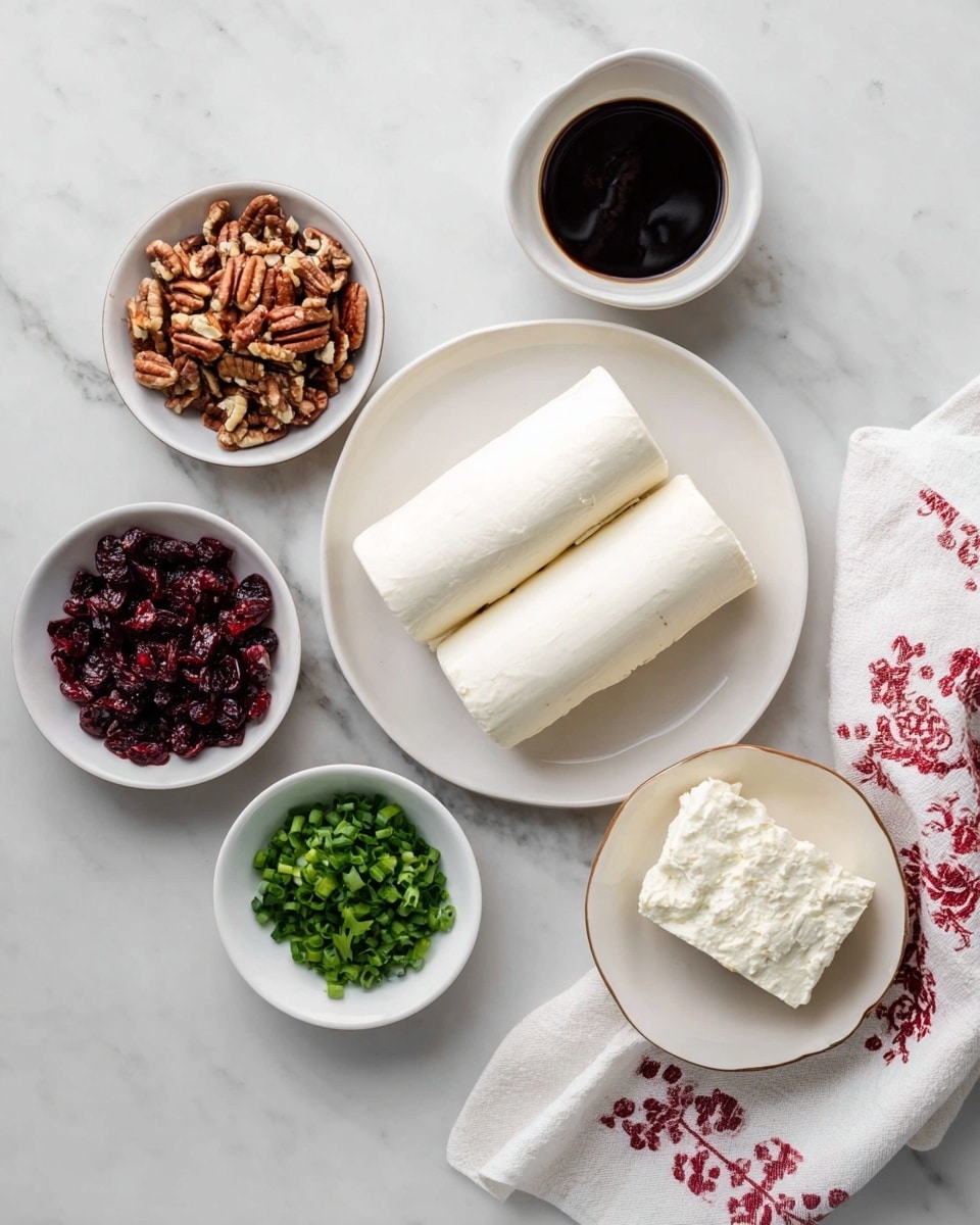 The image shows six white bowls and a white plate arranged on a white marbled surface. The white plate in the center holds two smooth, cylindrical white cheese logs. Surrounding the plate, there are five round white bowls: one filled with chopped pecans in a warm brown color, one with finely chopped green onions showing a vibrant green, one with small, dark red dried cranberries, one with a dark liquid likely a syrup or sauce, and one with a single large piece of creamy white cheese with a soft texture. A white cloth with red patterns is placed to the right side of the setup. photo taken with an iphone --ar 4:5 --v 7