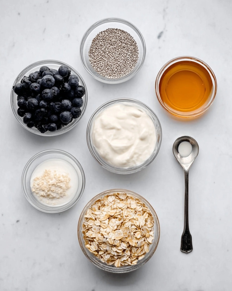 The image shows six small clear glass bowls arranged neatly on a white marbled surface. From left to right, the first bowl contains dark blueberries with a smooth texture, the second holds white seeds with a tiny size and rough texture, the third bowl is filled with a thick white cream, the fourth has light brown rolled oats with a coarse texture, the fifth contains a smooth amber liquid, and the sixth bowl shows off a creamy white milk with a smooth surface, served with a silver measuring spoon beside it. photo taken with an iphone --ar 4:5 --v 7