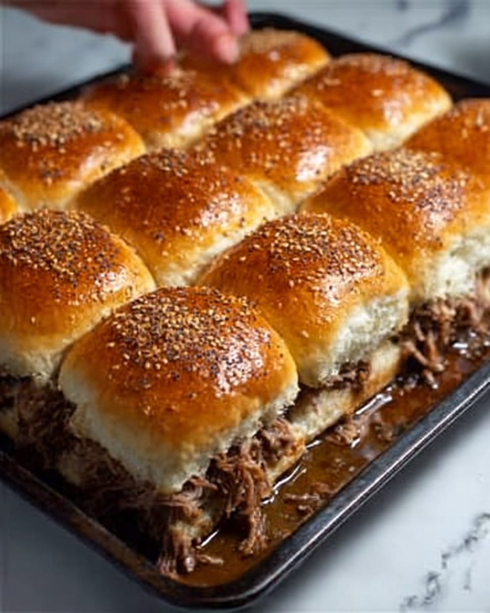 The image shows a tray of twelve soft sandwich buns with a shiny, golden-brown top sprinkled with sesame and poppy seeds. The buns are neatly arranged in three rows and four columns, with the edges of the buns touching each other. Inside the sandwich, visible along the side, there are layers of pulled meat that look tender and juicy, with some sauce dripping at the bottom. The tray is set on a white marbled surface, and a woman's hand is slightly touching the bottom right bun. photo taken with an iphone --ar 4:5 --v 7