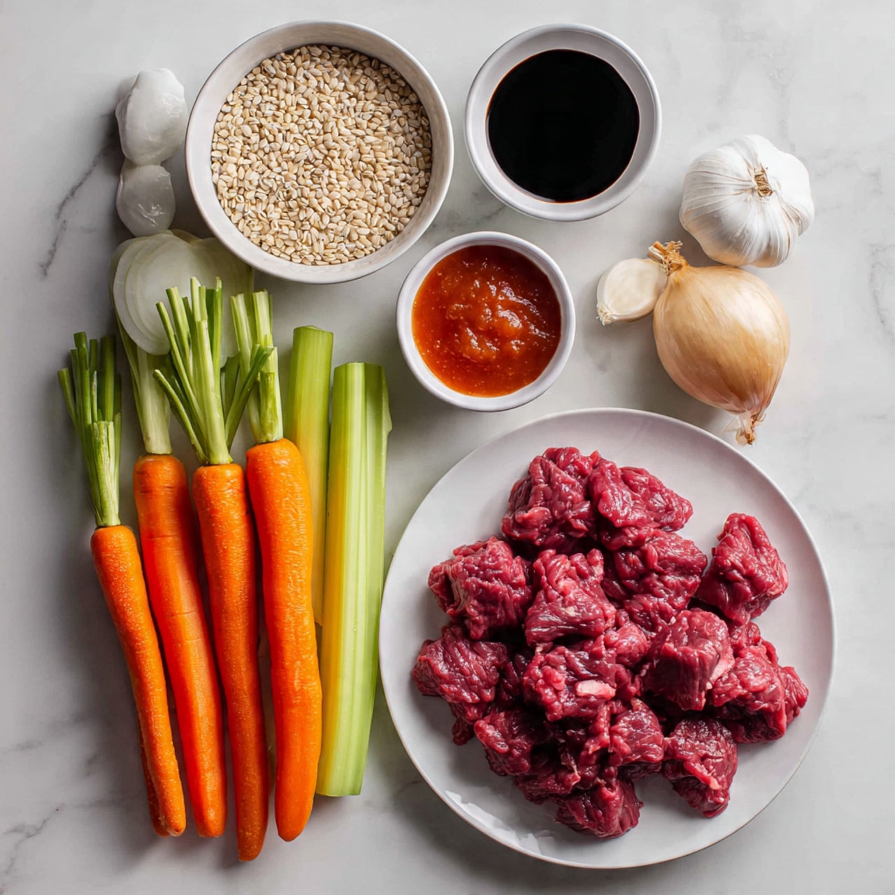 The image shows raw ingredients for cooking arranged on a white marbled surface: in the top right corner, a white plate filled with small pieces of red raw meat; below it, a small white bowl with dark soy sauce; next to it, another small white bowl with thick red sauce; on the left side, three bright orange carrots with fresh green tops, three celery sticks, a whole yellow onion, and three garlic cloves. Above these, there is a small white bowl filled with beige pearl barley grains. The ingredients are neatly spaced and clean, ready for preparation, photo taken with an iphone --ar 4:5 --v 7