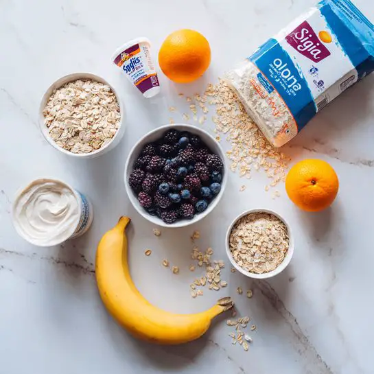 The image shows several food items arranged on a white marbled surface. There is a white bowl filled with dark blueberries and blackberries in the center, with a white cup of dry oats and a small white cup of light brown cereal beside it. A yellow banana lies curved below these bowls. Two white containers of yogurt are placed next to the bowls, one labeled siggi's and the other Dannon. Behind these items, there is a blue and white bag of oats with some oats scattered near it. Two small orange fruits are placed near the yogurt containers. The photo taken with an iphone --ar 4:5 --v 7