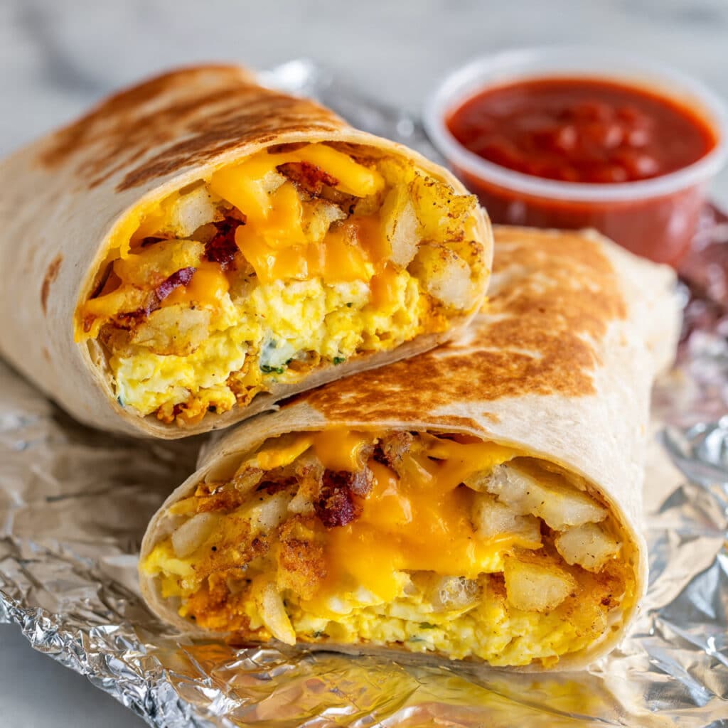 Hearty Breakfast Burrito with Scrambled Eggs, Cheese, and Savory Fillings Recipe
