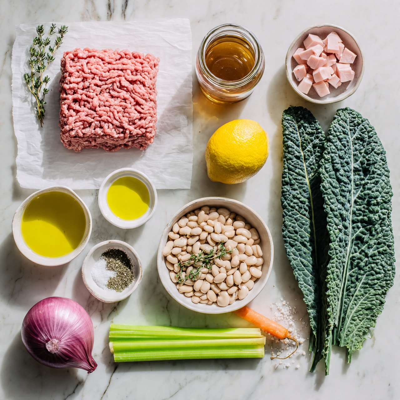 The image shows many fresh ingredients arranged on a white marbled surface. At the center is a large square of pink ground meat sitting on white parchment paper. Above it is a jar filled with brownish liquid. To the right of the meat is a half yellow lemon and three large dark green kale leaves with a textured surface. Below the meat is a bright orange carrot and two light green celery sticks side by side. To the left of the carrot are two small white bowls, one with golden olive oil and the other with white salt. Above the salt bowl is a small white bowl with green dried herbs. Next to this is a larger white bowl filled with light beige beans. Above the beans is a purple shallot with a paper-like skin and two small green thyme sprigs with tiny leaves. Between the carrot and meat are two small garlic cloves. Above the shallot is a small white bowl filled with small pinkish white cubes of fat or meat. photo taken with an iphone --ar 4:5 --v 7