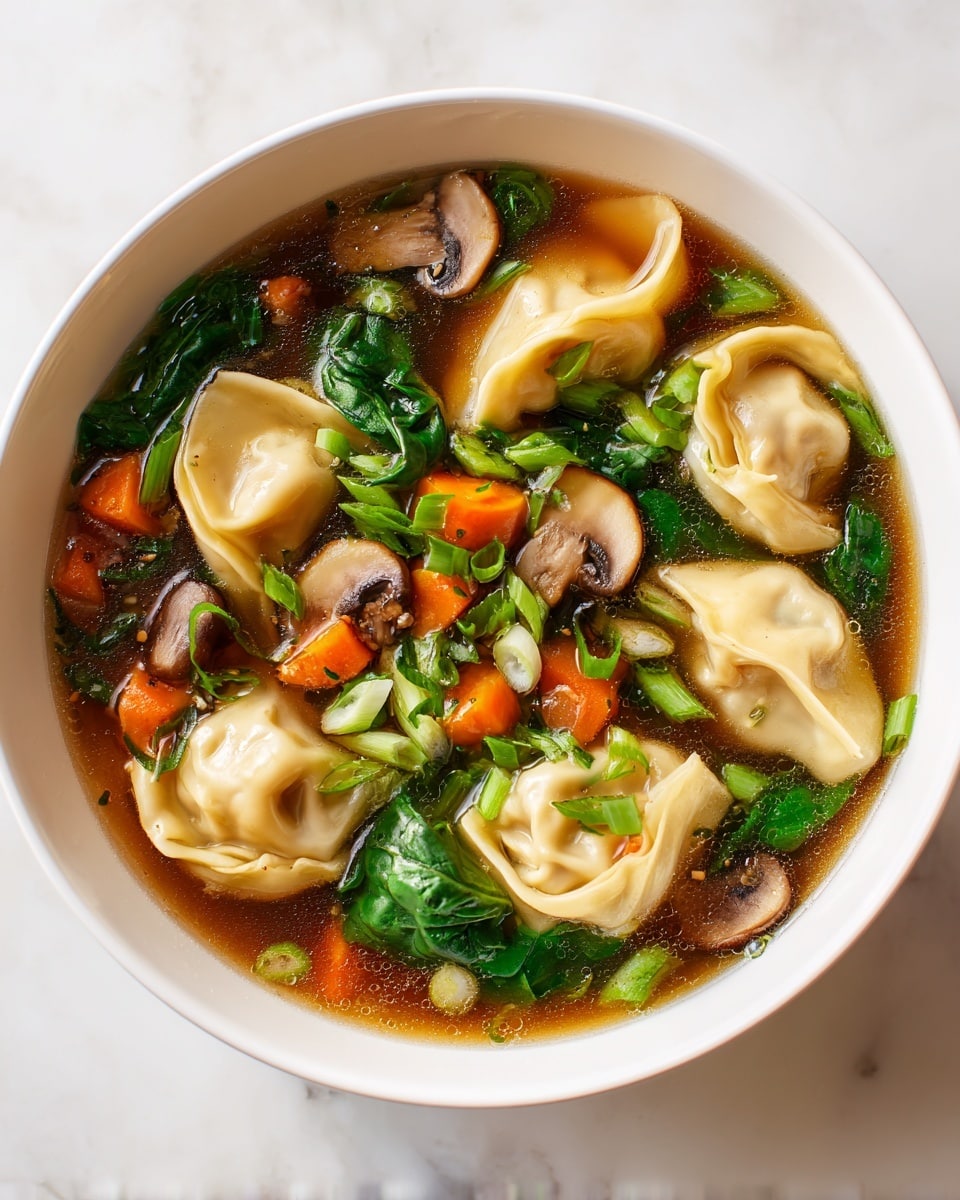 A white bowl filled with clear brown broth holds several light beige dumplings with soft, folded edges, scattered green spinach leaves, small diced bright orange carrots, slices of brown mushrooms with white stems, and chopped green onions spread across the top. The bowl sits on a white marbled surface, showing the colorful mix of vegetables and dumplings floating in the warm soup. photo taken with an iphone --ar 4:5 --v 7