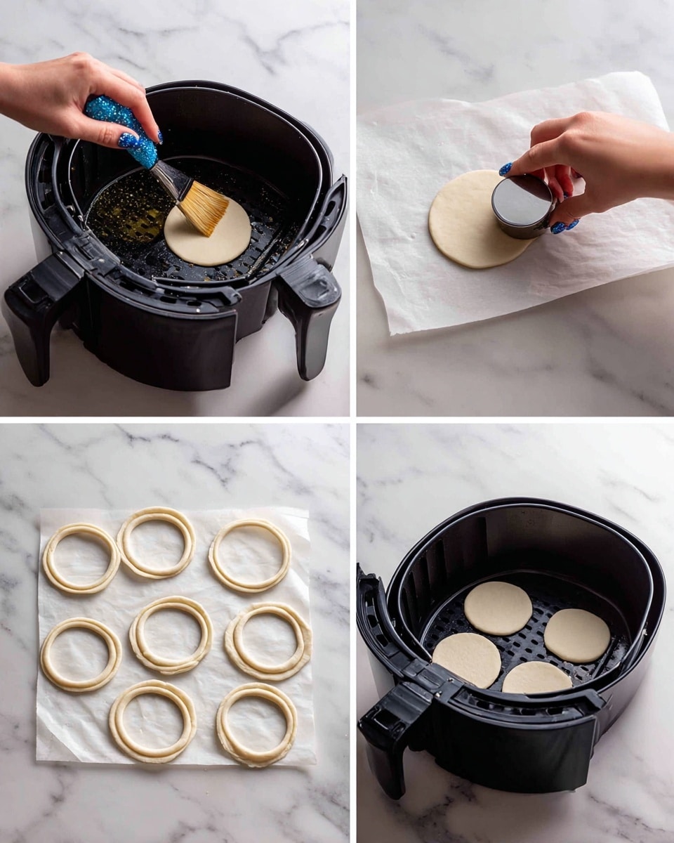 The image shows a four-step process for making dough rings. In the top left, a woman's hand with blue glittery nail polish brushes oil inside a black air fryer basket, which is positioned on a white marbled surface. The top right shows the same woman's hand pressing a small round metal cutter into a thick, pale dough disc on parchment paper over the white marbled surface. The bottom left displays several dough rings and dough circles arranged on parchment paper on the white marbled surface. The bottom right shows five evenly spaced dough rings placed inside the black air fryer basket. photo taken with an iphone --ar 4:5 --v 7