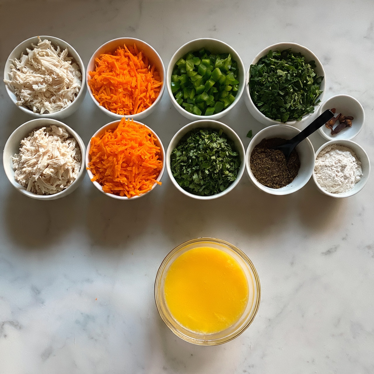 square image The image shows seven white bowls placed on a white marbled surface. From left to right, the first bowl contains shredded white chicken, the second has finely chopped orange carrots, the third holds chopped green bell peppers, the fourth is filled with roughly chopped green leafy herbs, the fifth contains a dark brown powder with a black spoon inside, the sixth has white flour, and the seventh small bowl has two brown cloves. There is also a glass bowl filled with yellow beaten eggs sitting on the surface. The arrangement is neat and evenly spaced. photo taken with an iphone --ar 4:5 --v 7